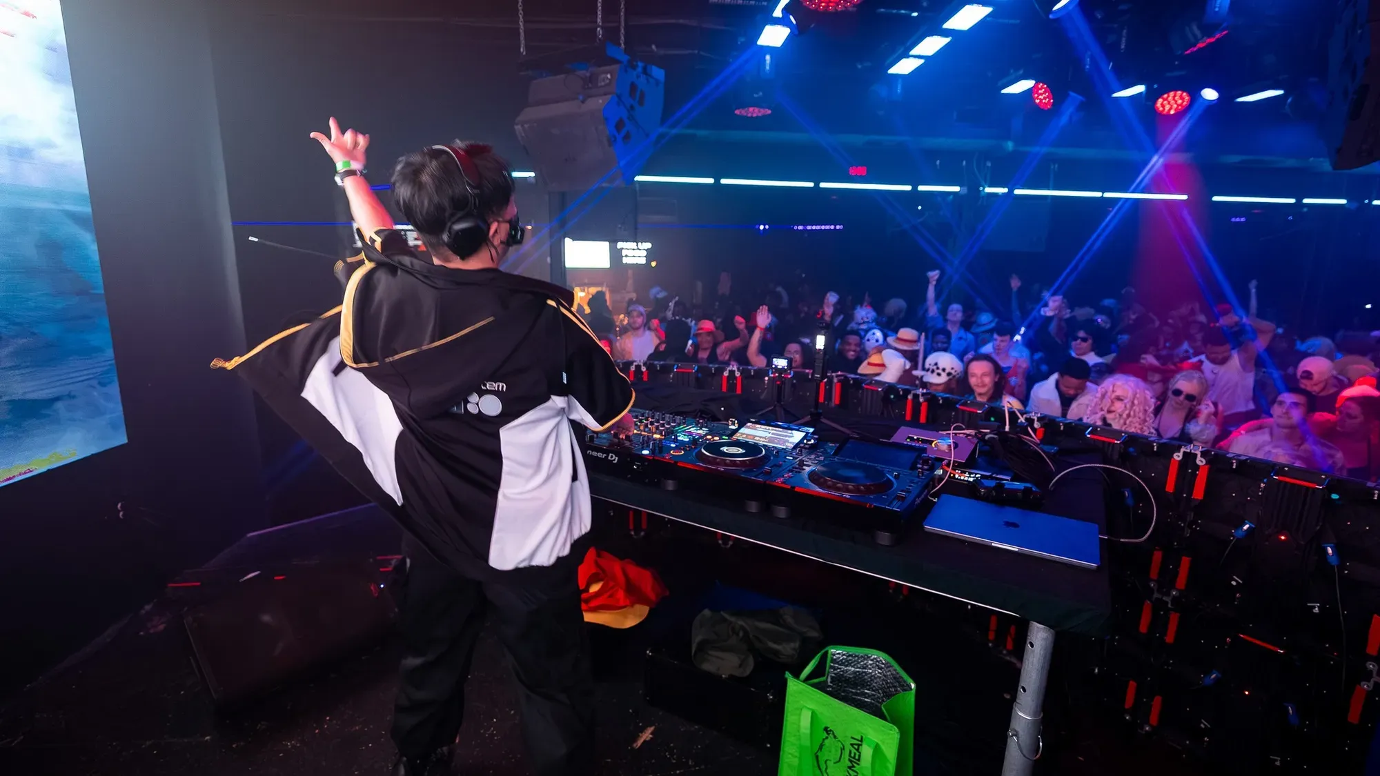 NINJ3FF3C7 — hyping the crowd at an anime rave, blue and purple stage lights with cosplayers in the audience