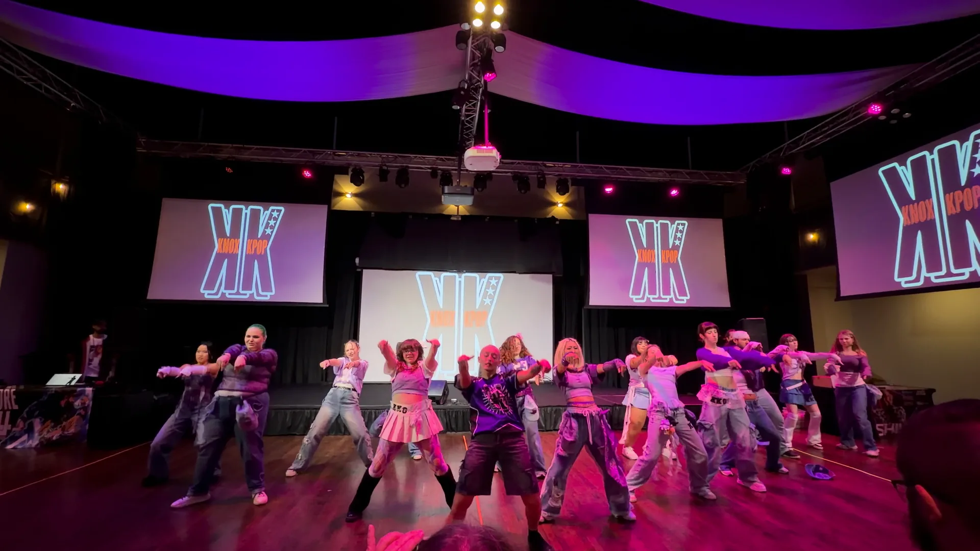 K-Pop dance crew in formation on the KPC 2026 main stage
